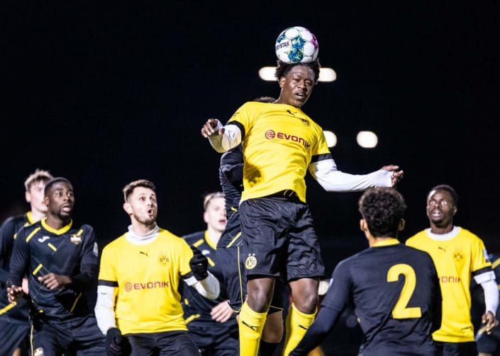 MILTON, ON – APR. 24, 2022: Players battle for the ball during a League1 Ontario men's soccer game between BVB IA Waterloo and Scrosoppi FC.
